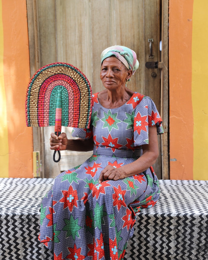 The Baba Tree Bolga Original Fan: Handwoven architectural wall art with intricate weave and premium leather handle.