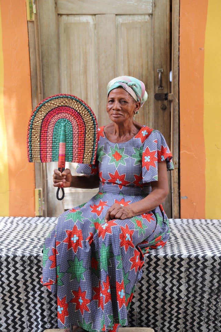 The Baba Tree Bolga Original Fan: Handwoven architectural wall art with intricate weave and premium leather handle.