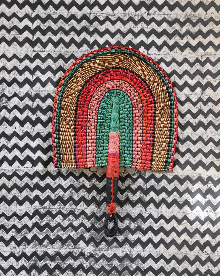 The Baba Tree Bolga Original Fan: Handwoven architectural wall art with intricate weave and premium leather handle.