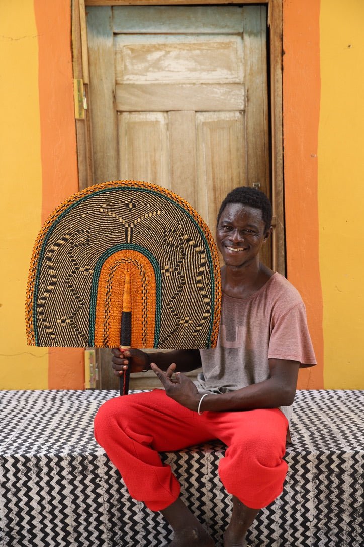 Naba Pengo Fan by The Baba Tree. Premium handwoven elephant grass wall art and artisanal Bolgatanga home decor.