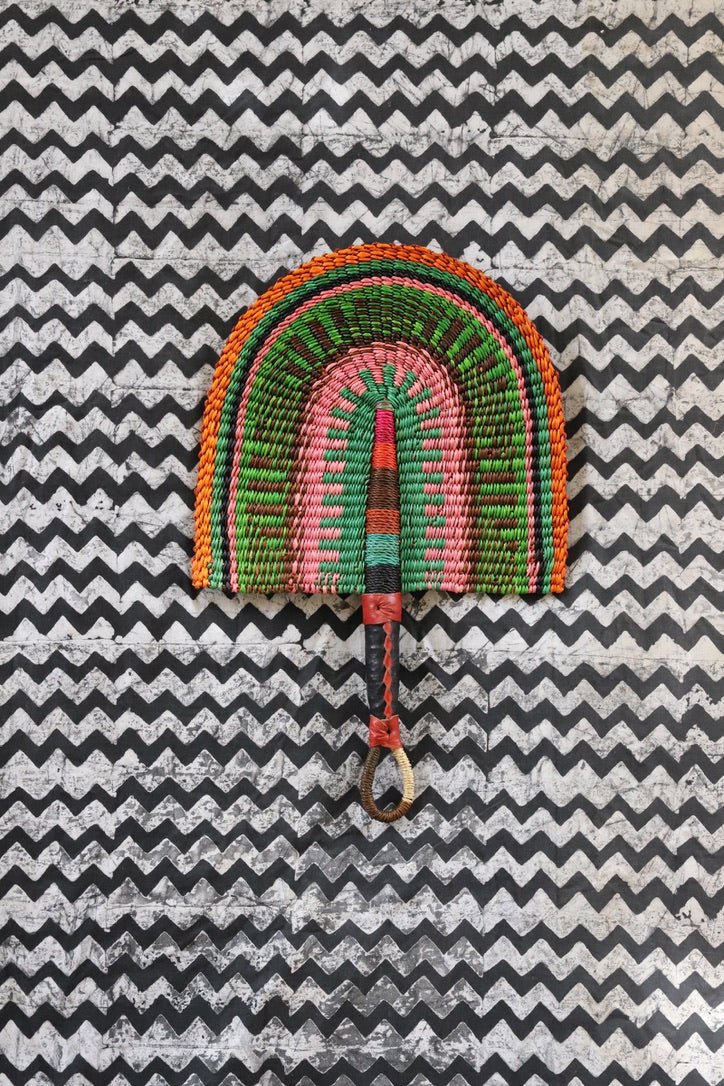 The Baba Tree Bolga Original Fan: Handwoven architectural wall art with intricate weave and premium leather handle.