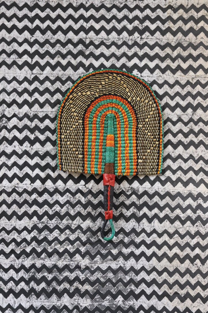 The Baba Tree Bolga Original Fan: Handwoven architectural wall art with intricate weave and premium leather handle.
