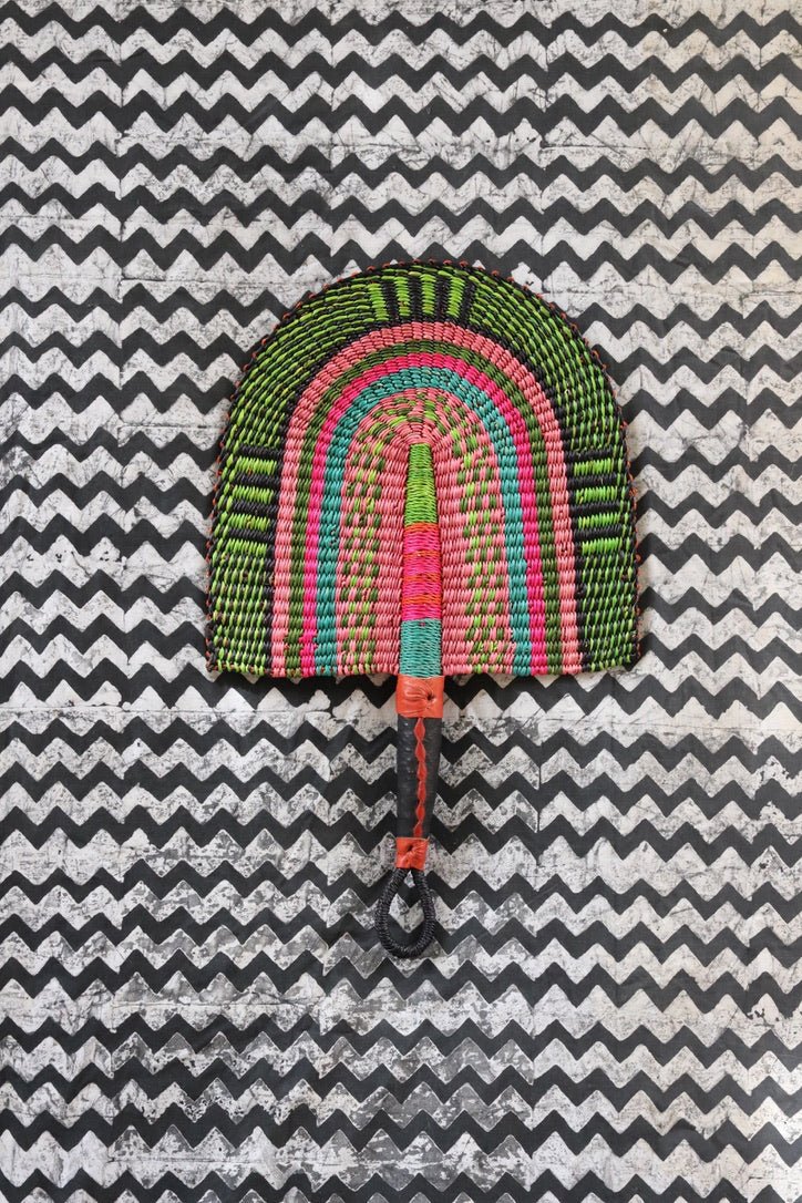 The Baba Tree Bolga Original Fan: Handwoven architectural wall art with intricate weave and premium leather handle.