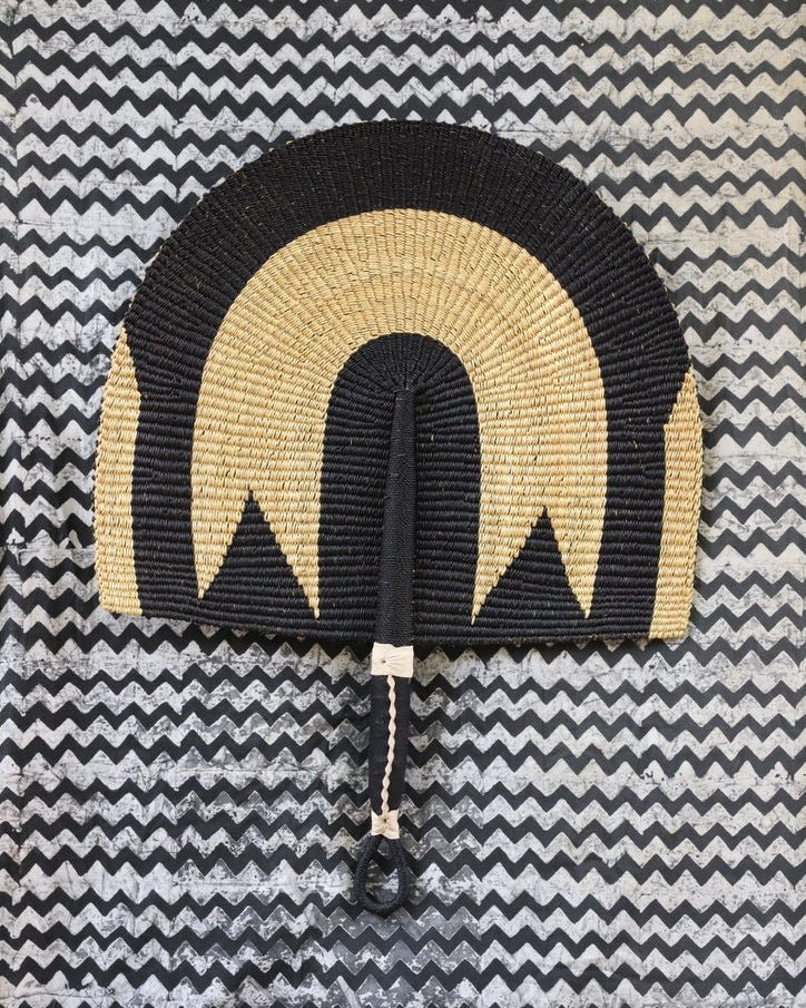 The Baba Tree Bolga Original Fan: Handwoven architectural wall art with intricate weave and premium leather handle.