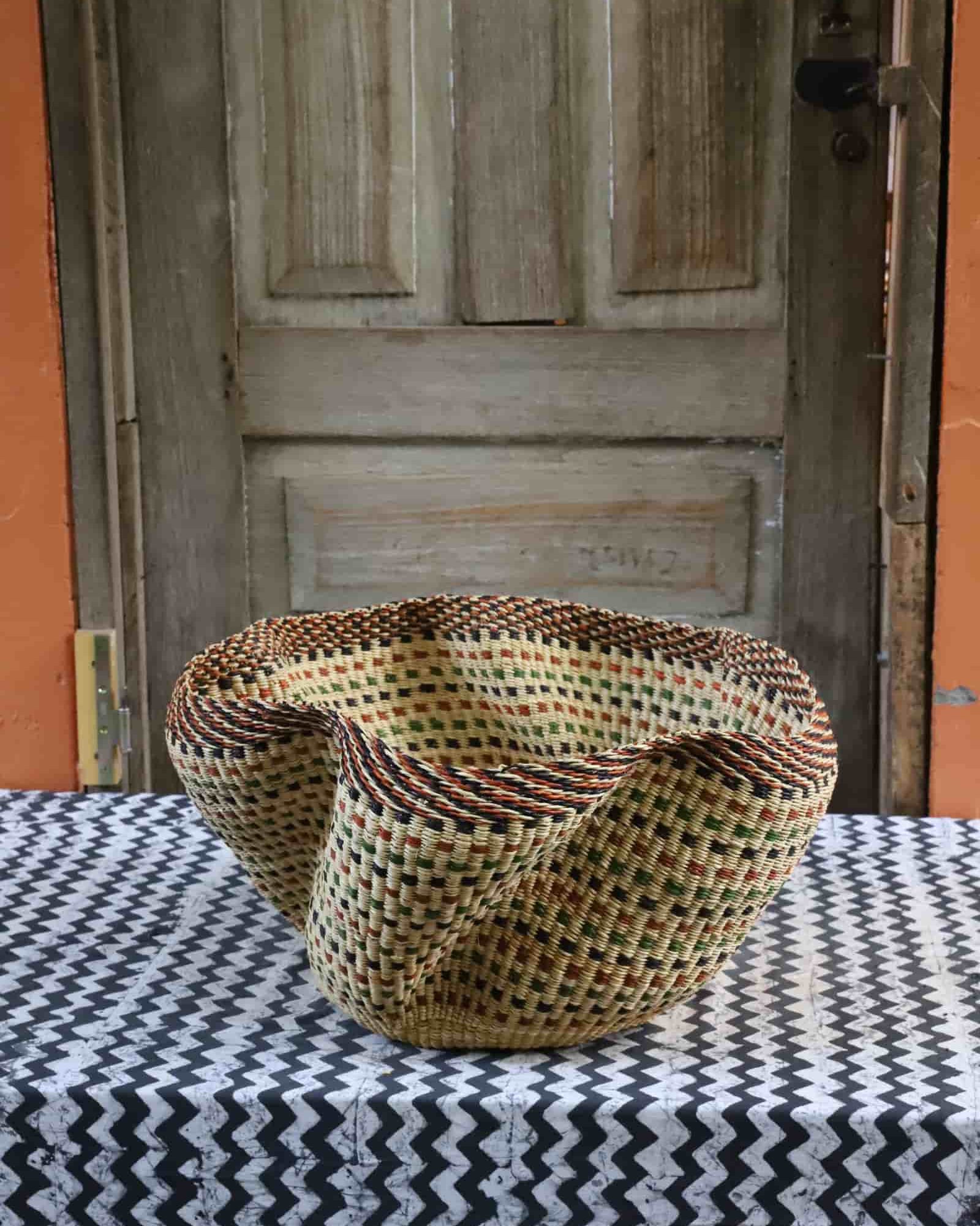 Large Pakurigo Wave Décor Basket in dark natural straw with amber, red and green check pattern