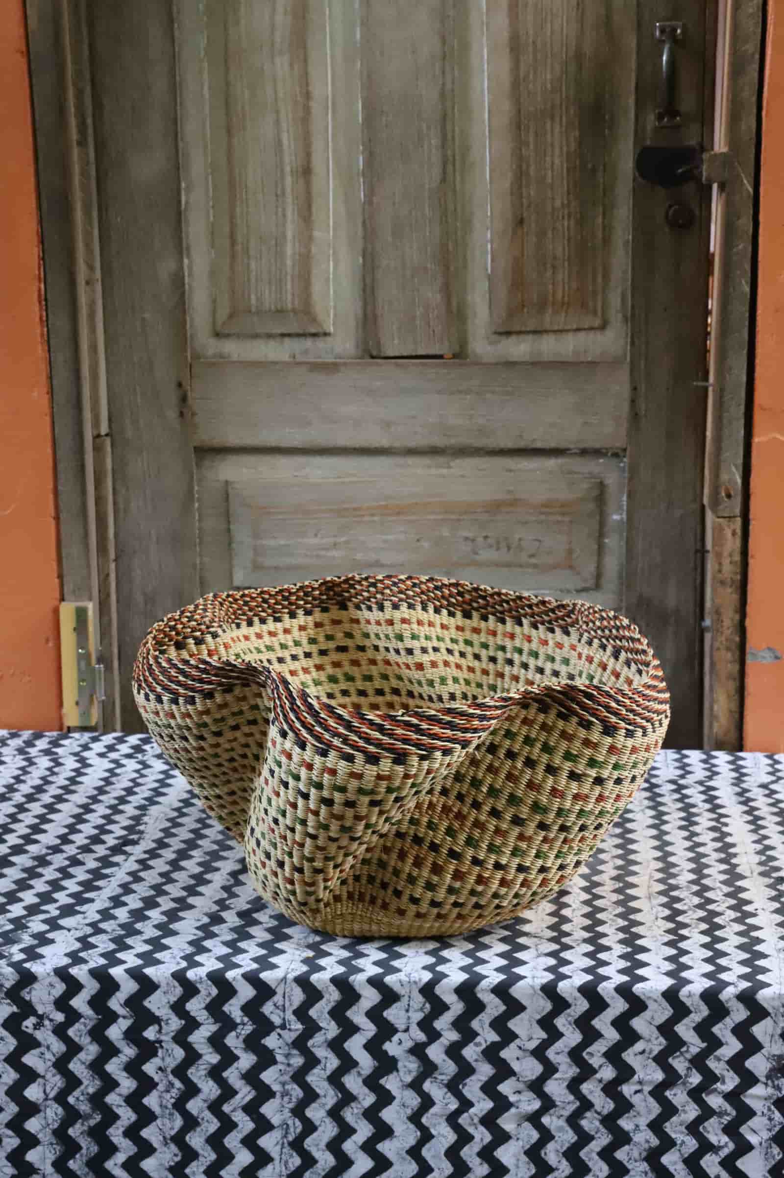 Large Pakurigo Wave Décor Basket in dark natural straw with amber, red and green check pattern