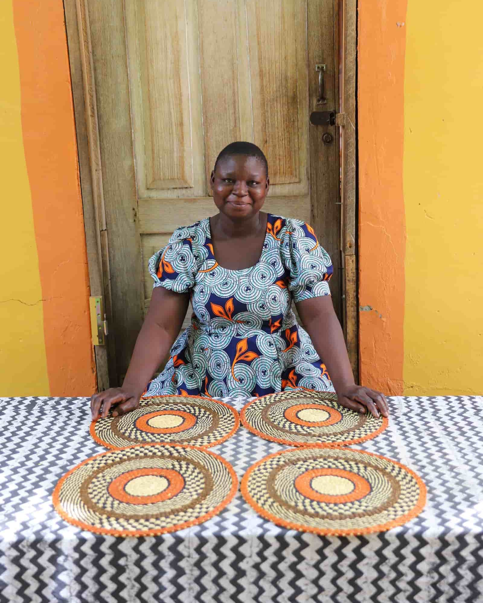 Set of 4 large placemats in orange with natural straw and checkered weave detailing