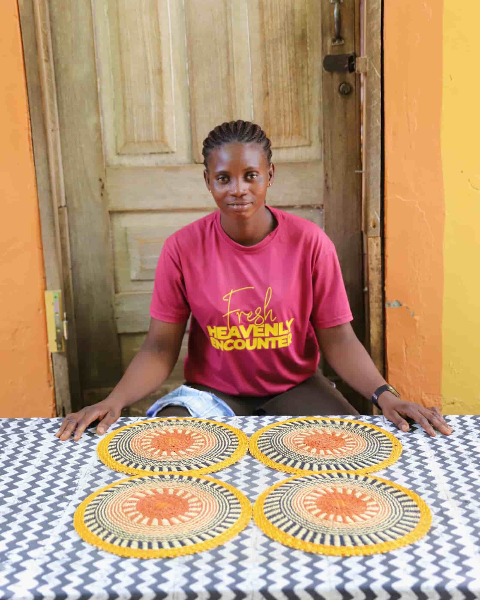 Set of 4 small placemats in yellow and black radial stripes with terracotta centres