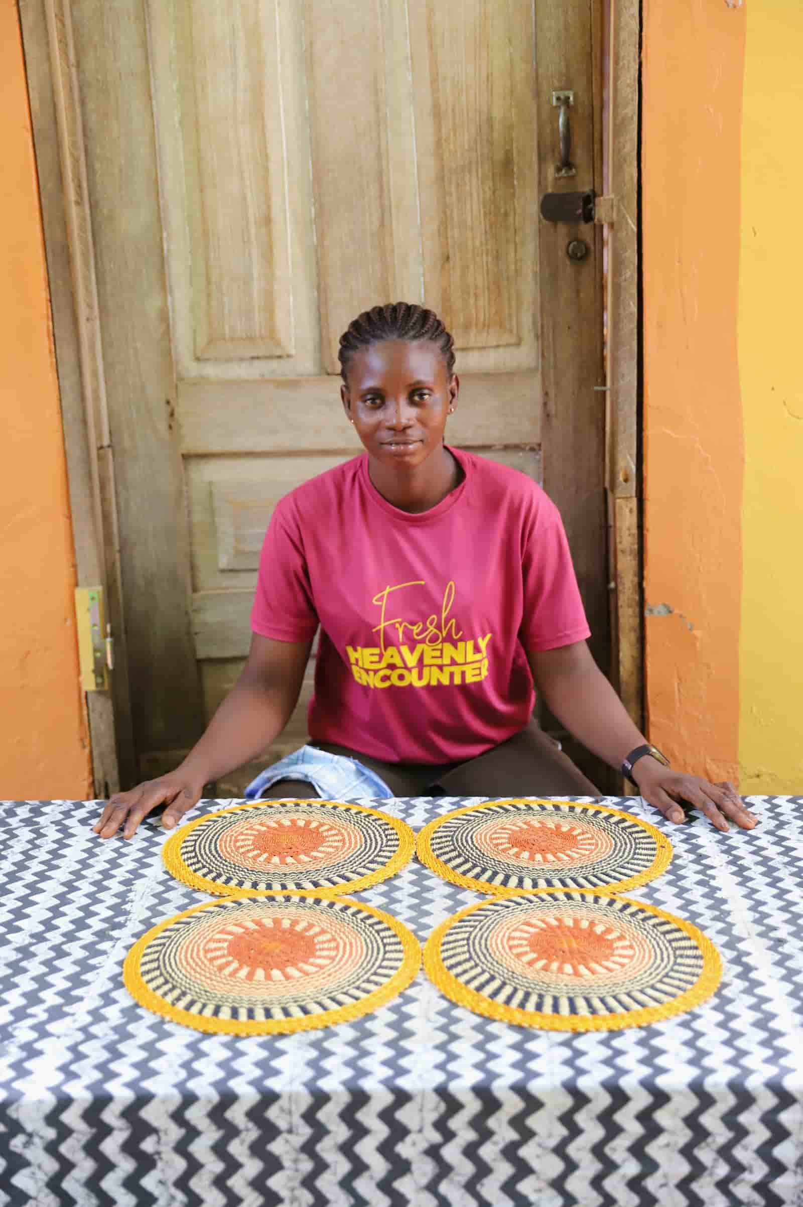 Set of 4 small placemats in yellow and black radial stripes with terracotta centres