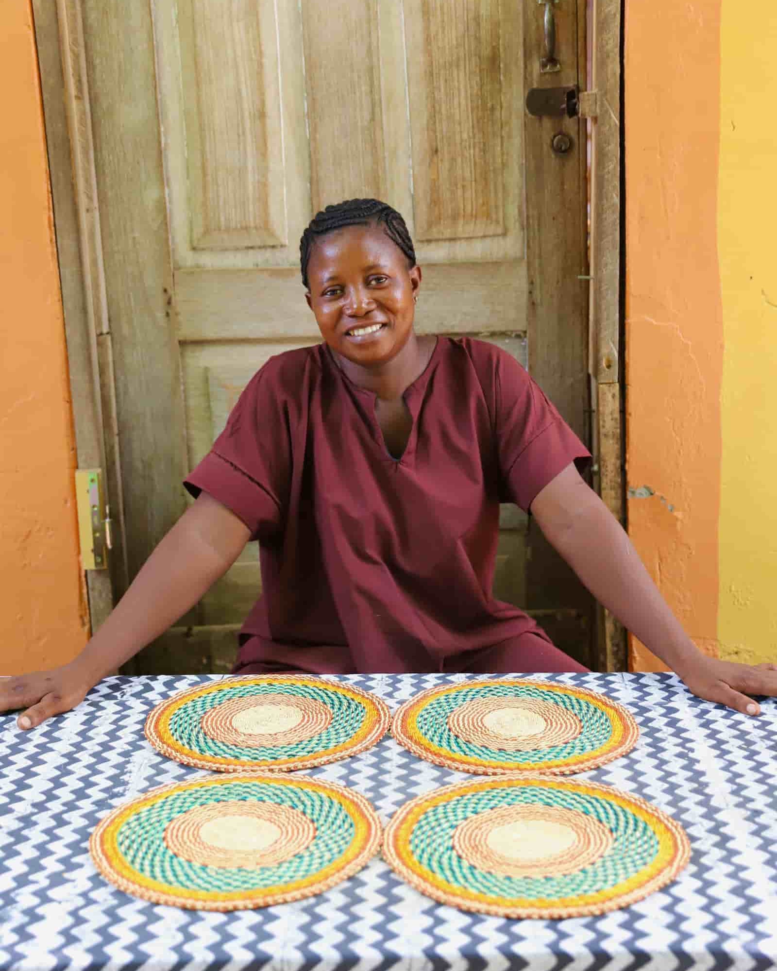 Set of 4 small woven placemats in green, orange and yellow concentric circles