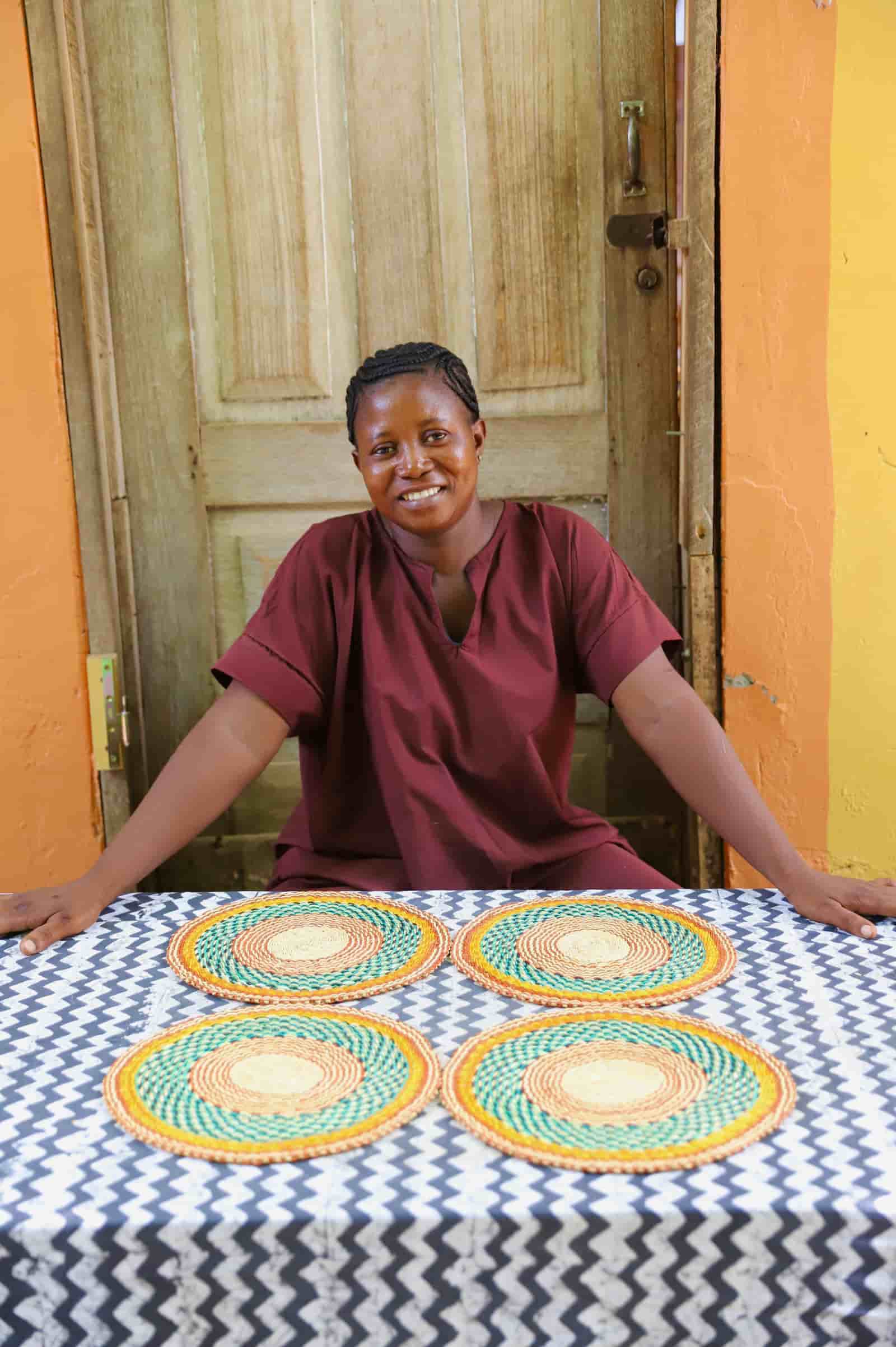 Set of 4 small woven placemats in green, orange and yellow concentric circles