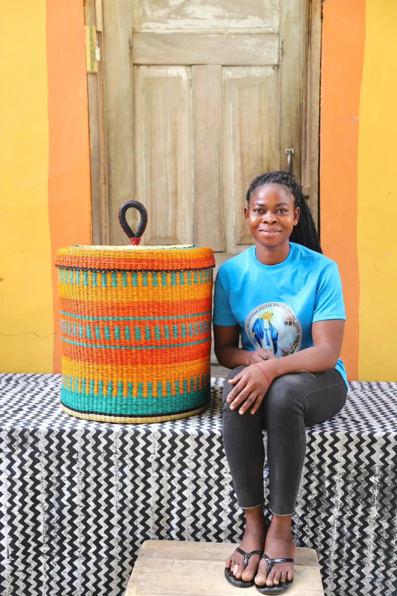 Lidded Laundry Basket (Large) by The Baba Tree. Handwoven elephant grass with leather handle. Premium Bolgatanga artisan decor.