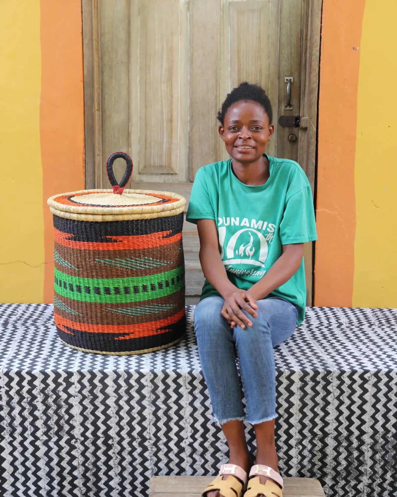 Lidded Laundry Basket with coil (Small) by The Baba Tree. Handwoven elephant grass with leather handle. Premium Bolgatanga artisan decor.