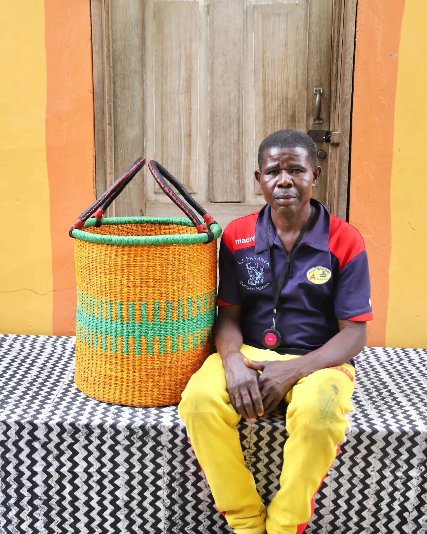 Open Laundry Basket (Small) by The Baba Tree. Handwoven elephant grass storage with leather handles. Bolgatanga artisan decor.