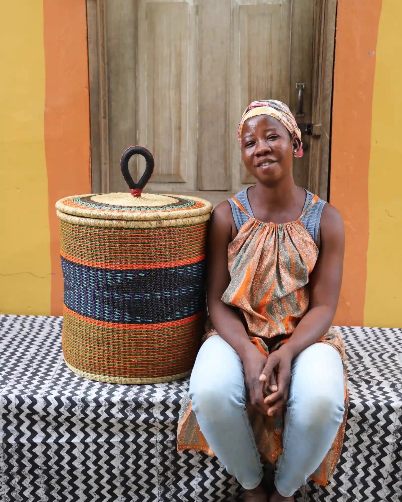 Lidded Laundry Basket with coil (Medium) by The Baba Tree. Handwoven elephant grass with leather handle. Premium Bolgatanga artisan decor.