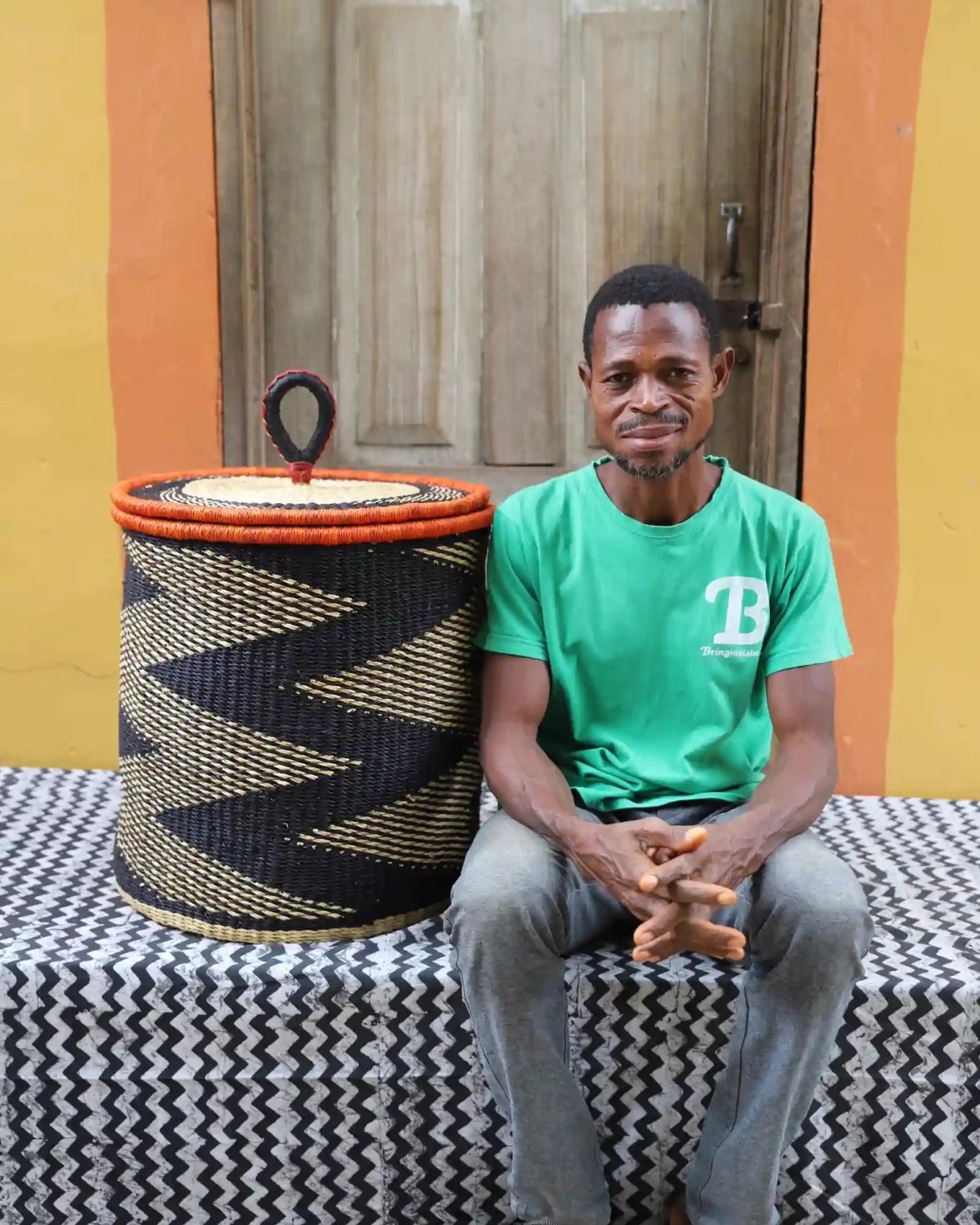 Lidded Laundry Basket with coil (Medium) by The Baba Tree. Handwoven elephant grass with leather handle. Premium Bolgatanga artisan decor.