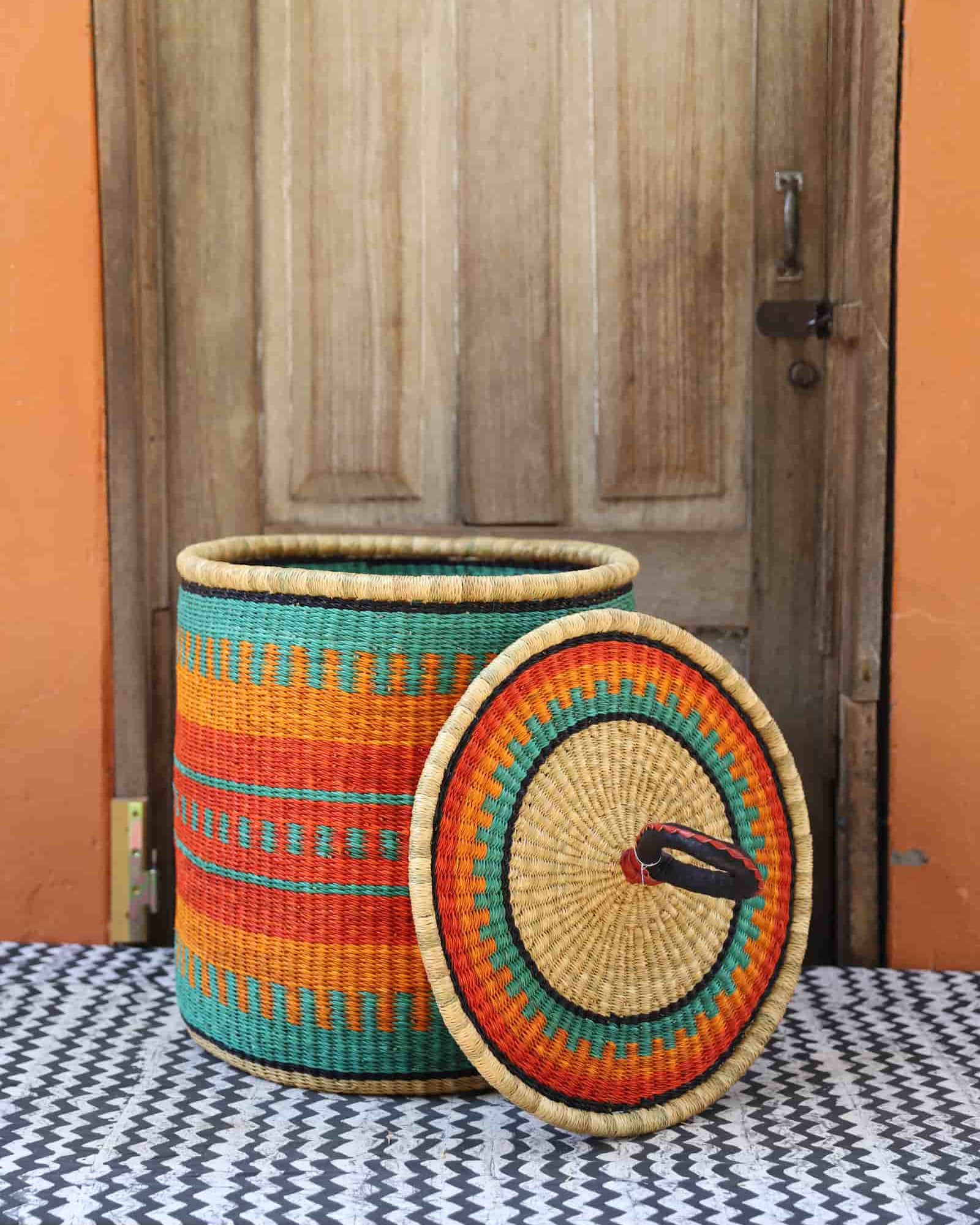 Lidded Laundry Basket with coil (Medium) by The Baba Tree. Handwoven elephant grass with leather handle. Premium Bolgatanga artisan decor.