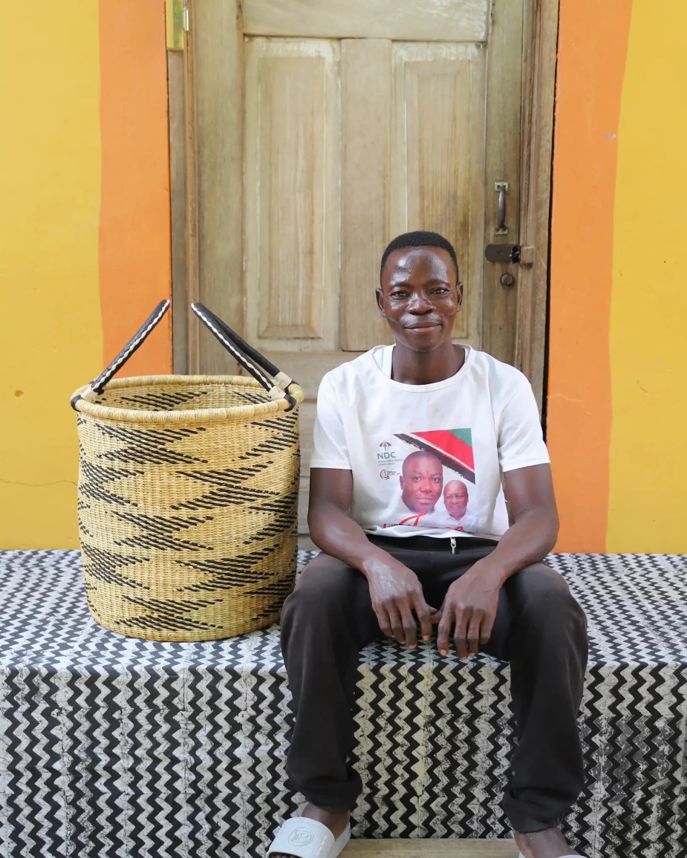 Open Laundry Basket (Small) by The Baba Tree. Handwoven elephant grass storage with leather handles. Bolgatanga artisan decor.