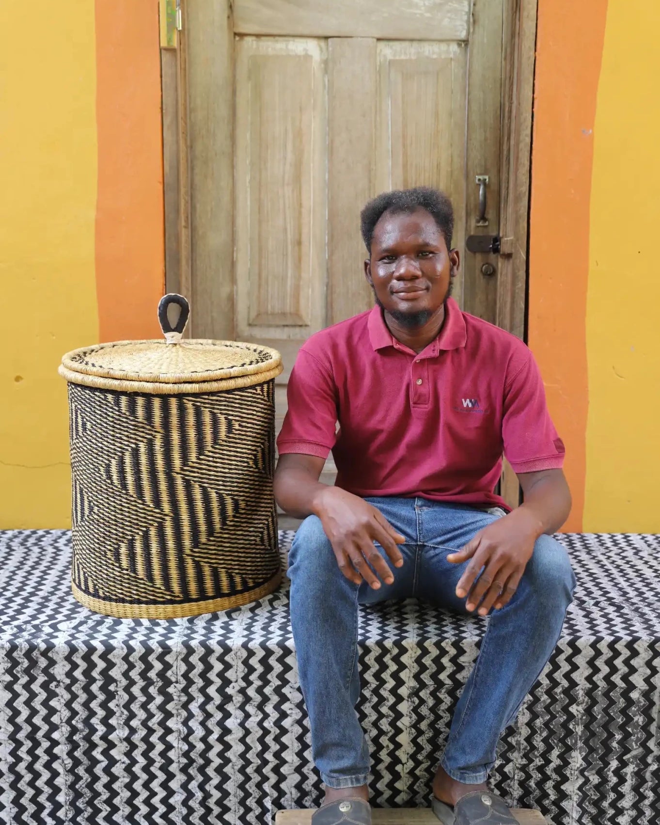 Lidded Laundry Basket with coil (Small) by The Baba Tree. Handwoven elephant grass with leather handle. Premium Bolgatanga artisan decor.