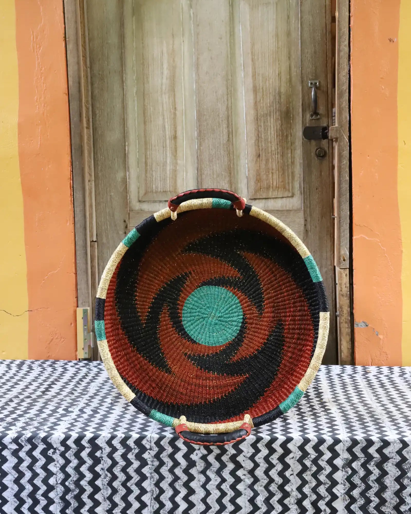 Woven Tray Wall Decor (small) by The Baba Tree. Premium elephant grass tray with leather handles. Bolgatanga artisan craftsmanship.
