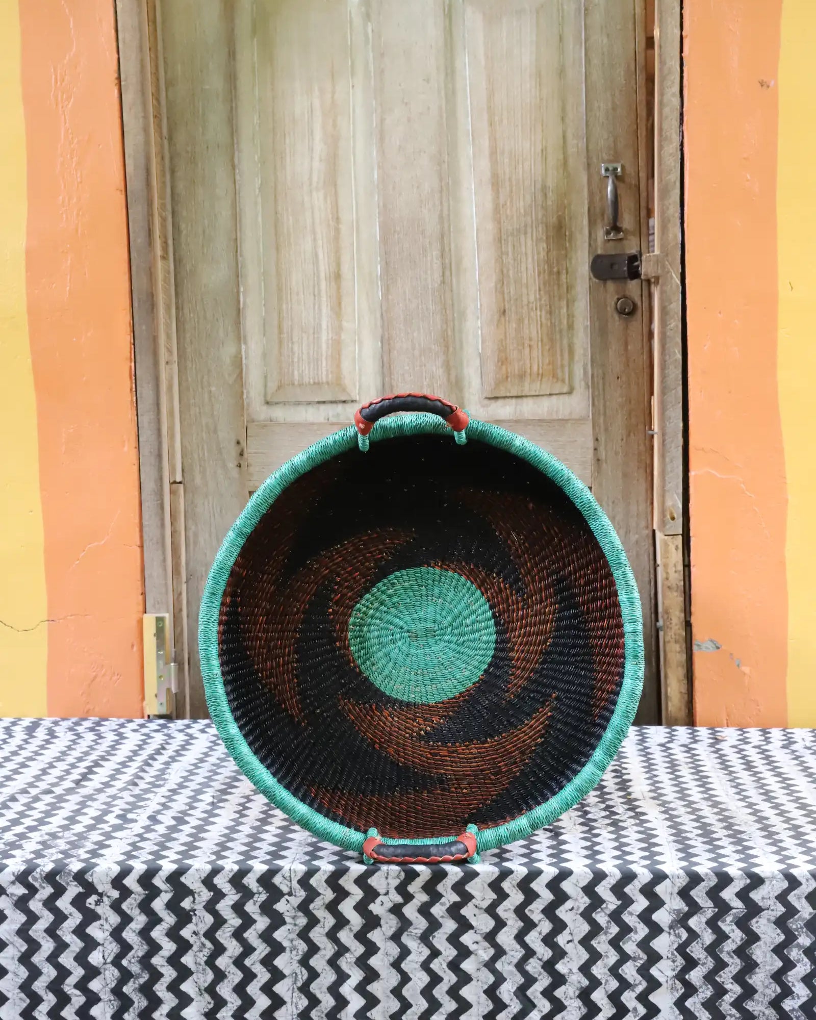 Woven Tray Wall Decor (small) by The Baba Tree. Premium elephant grass tray with leather handles. Bolgatanga artisan craftsmanship.