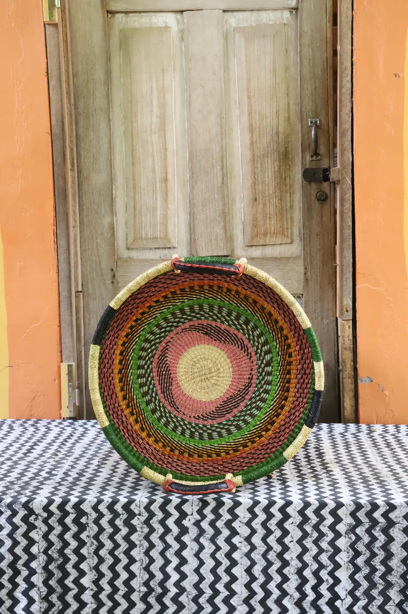 Woven Tray Wall Decor (Large) by The Baba Tree. Premium elephant grass tray with leather handles. Bolgatanga artisan craftsmanship.