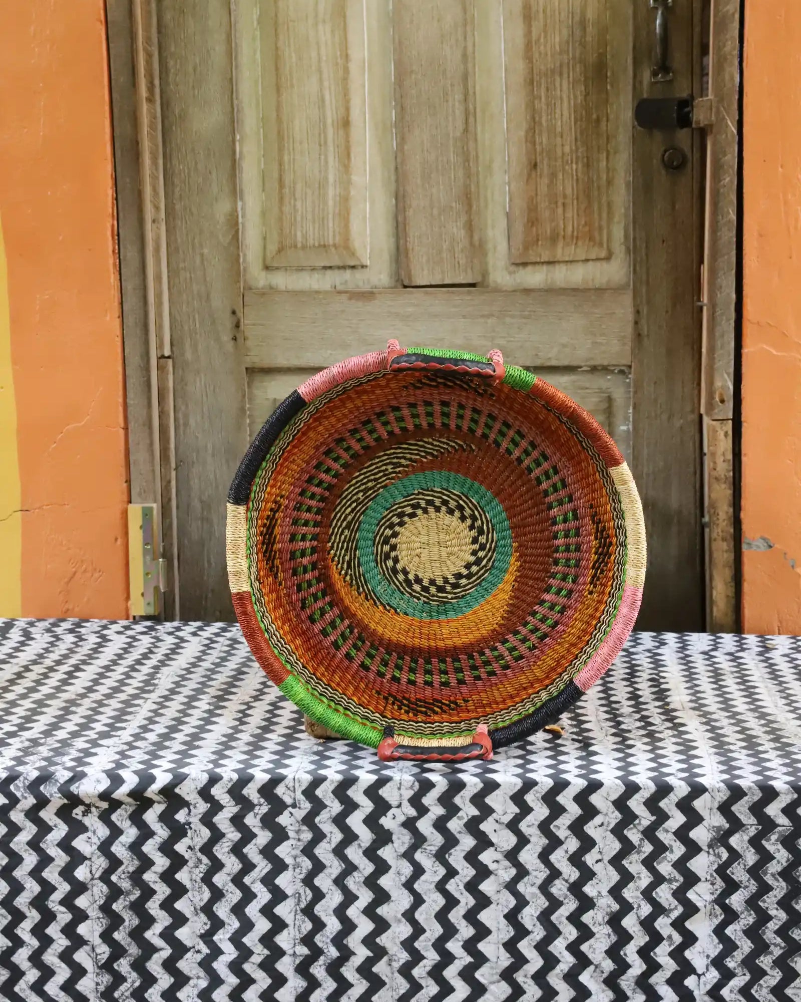 Woven Tray Wall Decor (small) by The Baba Tree. Premium elephant grass tray with leather handles. Bolgatanga artisan craftsmanship.