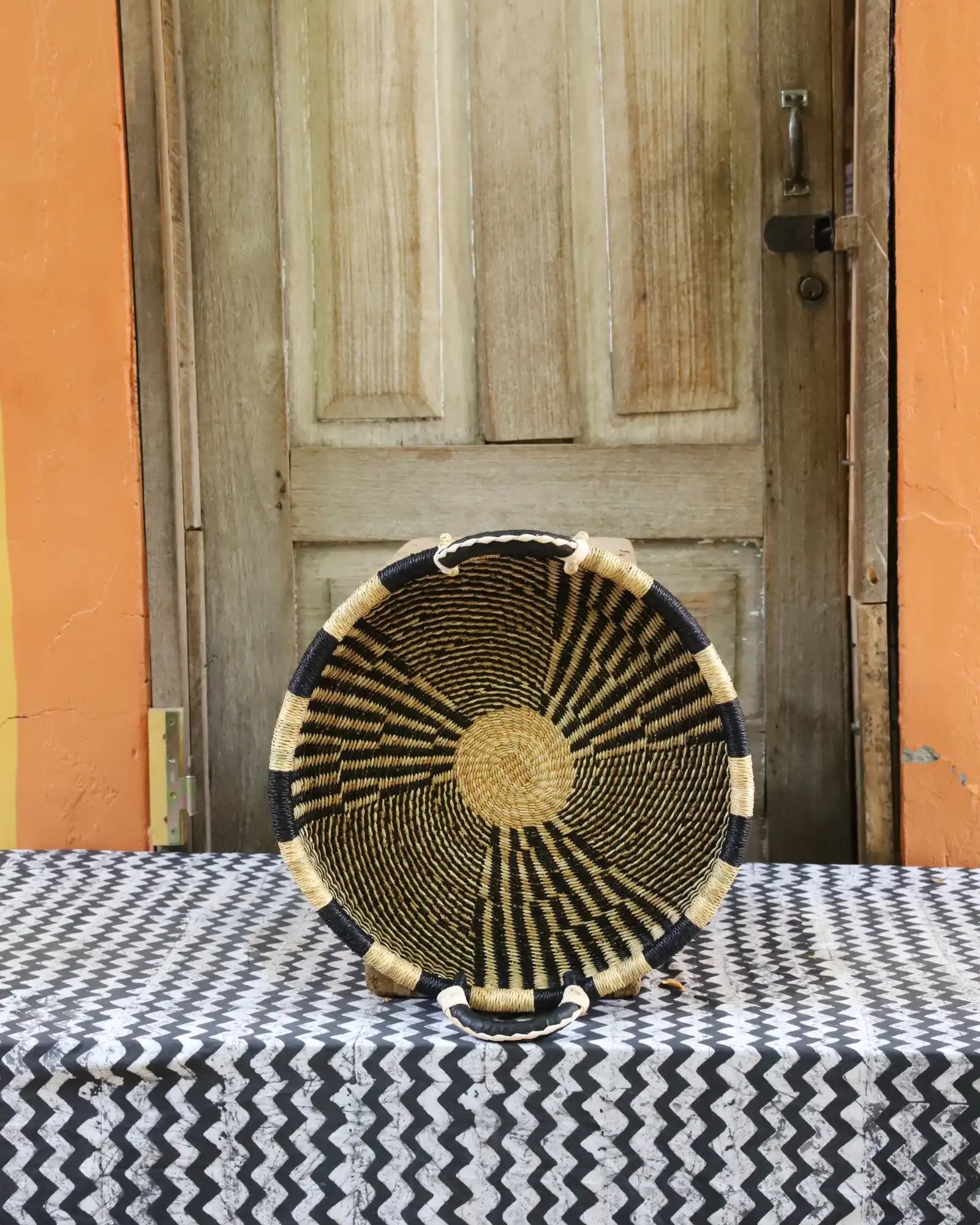 Woven Tray Wall Decor (small) by The Baba Tree. Premium elephant grass tray with leather handles. Bolgatanga artisan craftsmanship.
