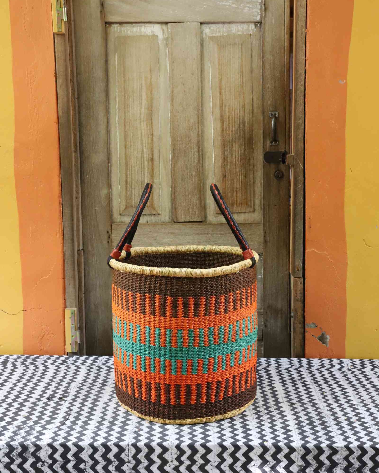 Medium open laundry basket, a handwoven Bolga basket in elephant grass, 46 cm wide.