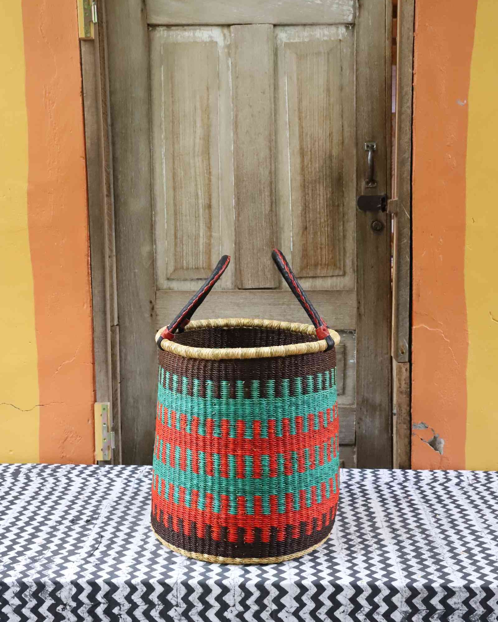 Small open laundry basket, a handwoven Bolga basket in elephant grass, 38 cm wide.