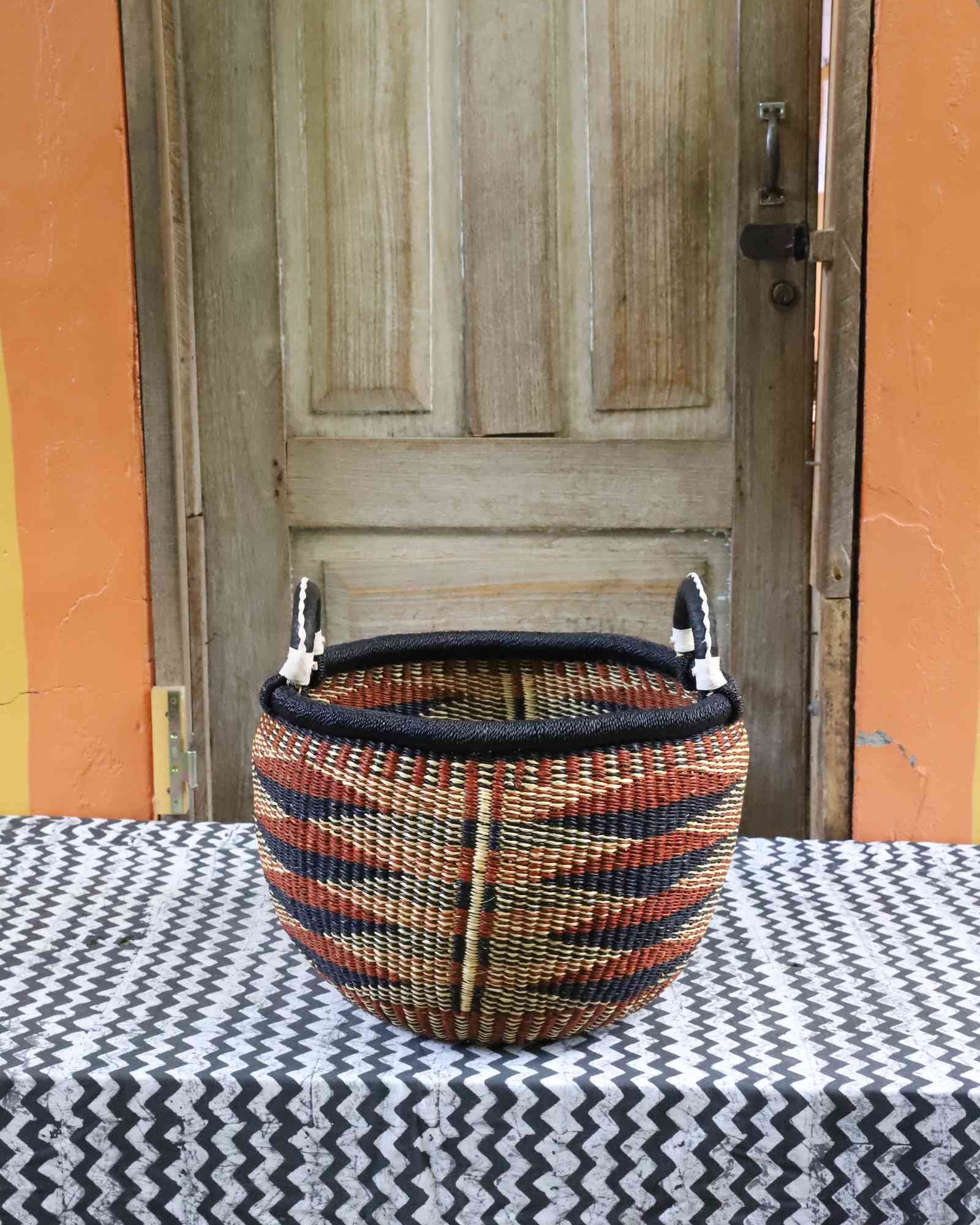 Deep round handwoven African storage basket with leather handle, large size
