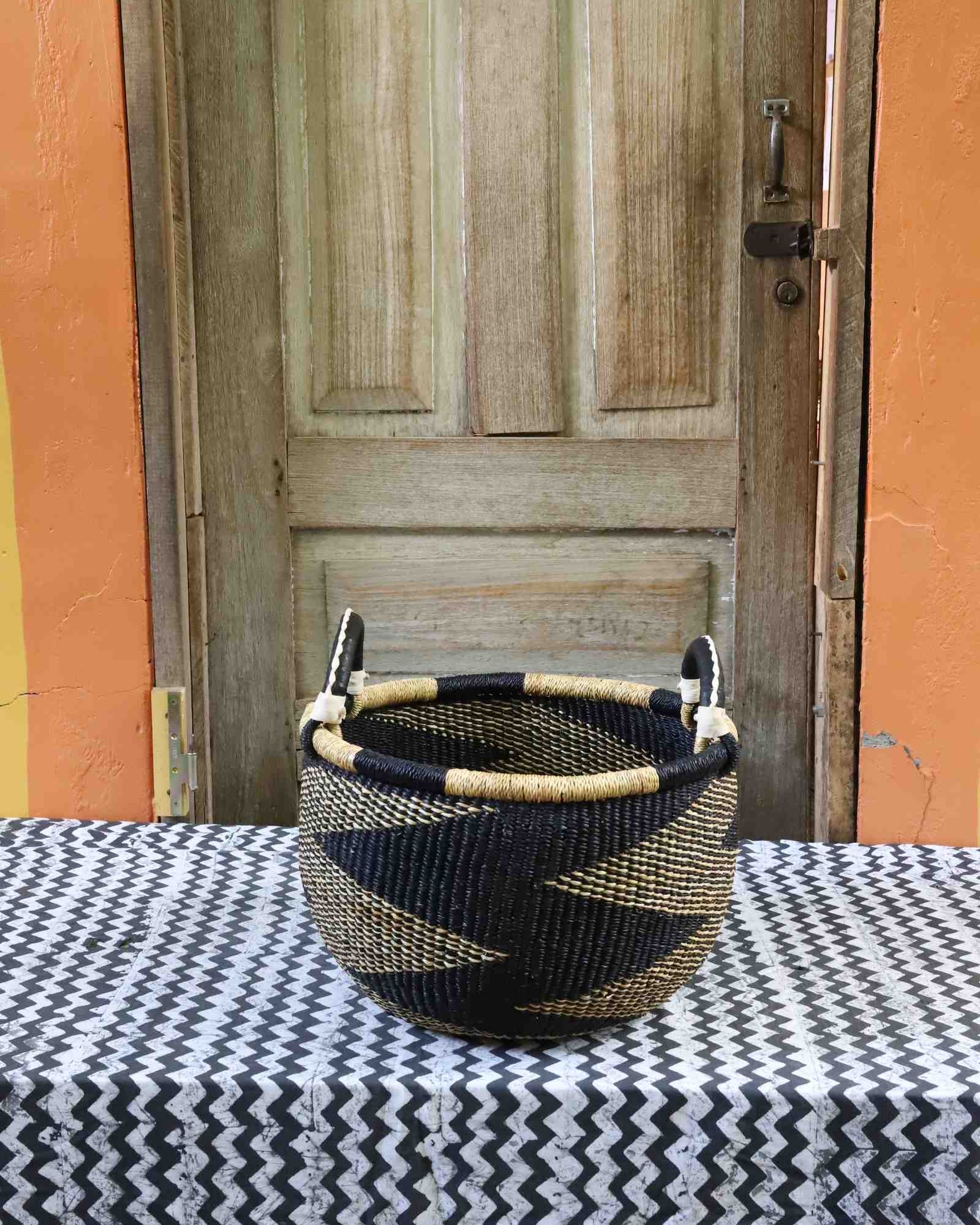 Handwoven round Gbenka storage basket, medium size with leather handle