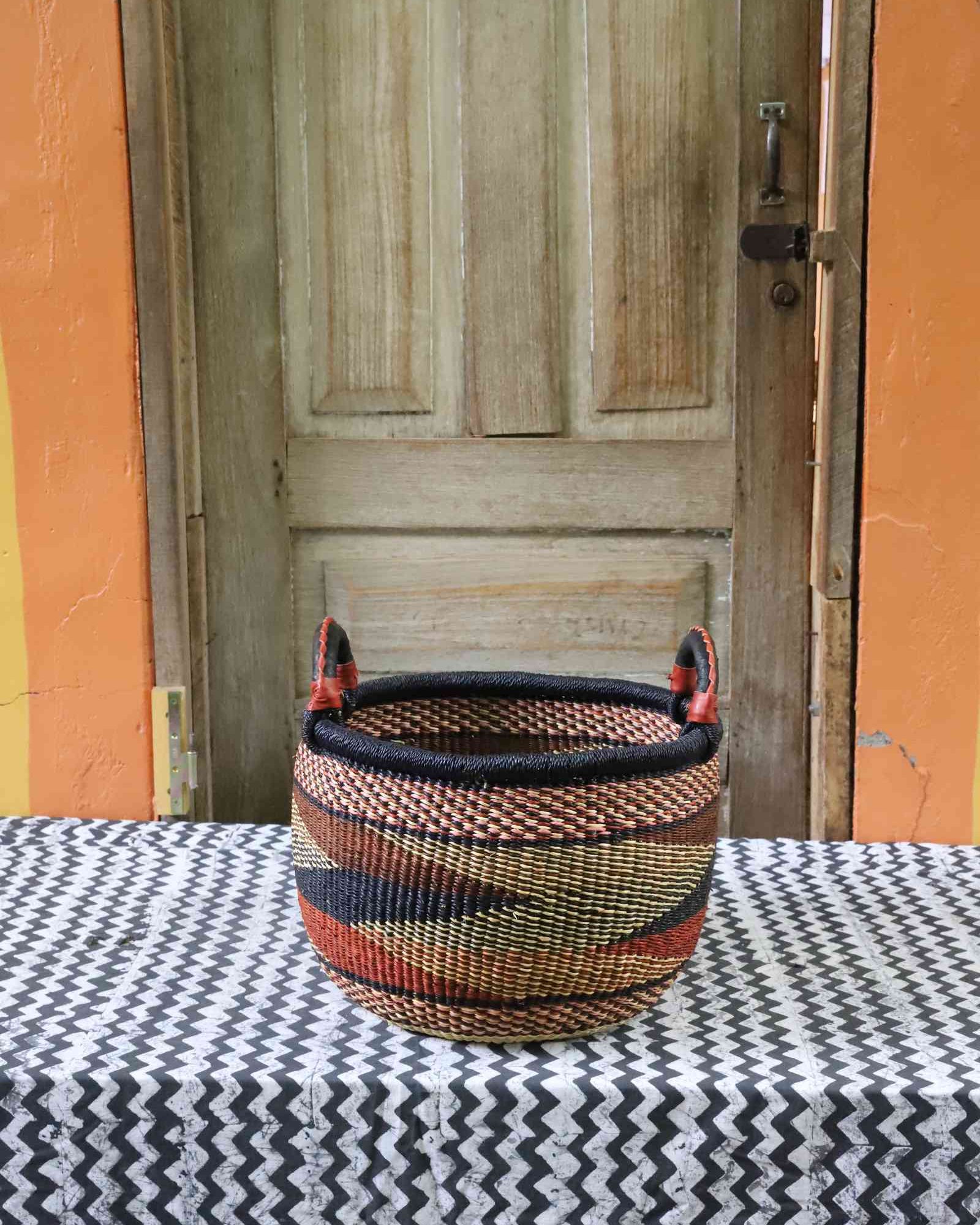 Handwoven African storage basket, medium round with leather handle and woven lid