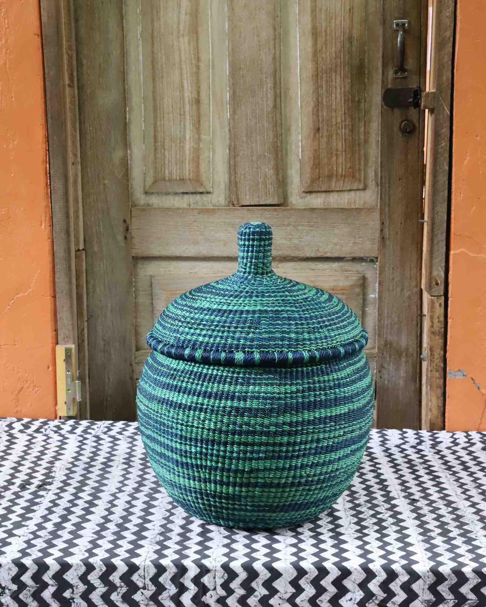Round globe-shaped handwoven African storage basket, medium