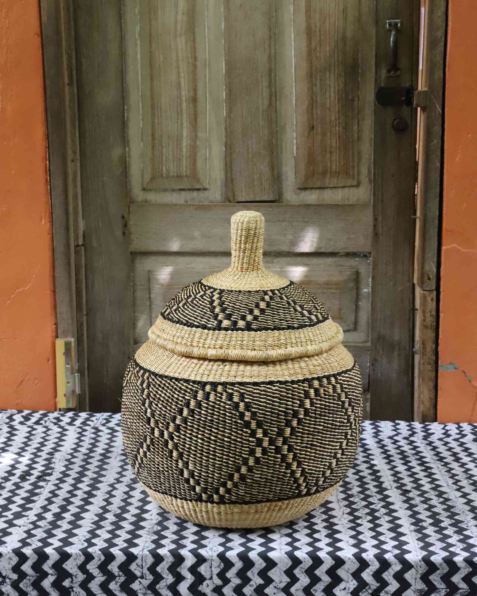 Spherical handwoven Bolga storage basket in medium size