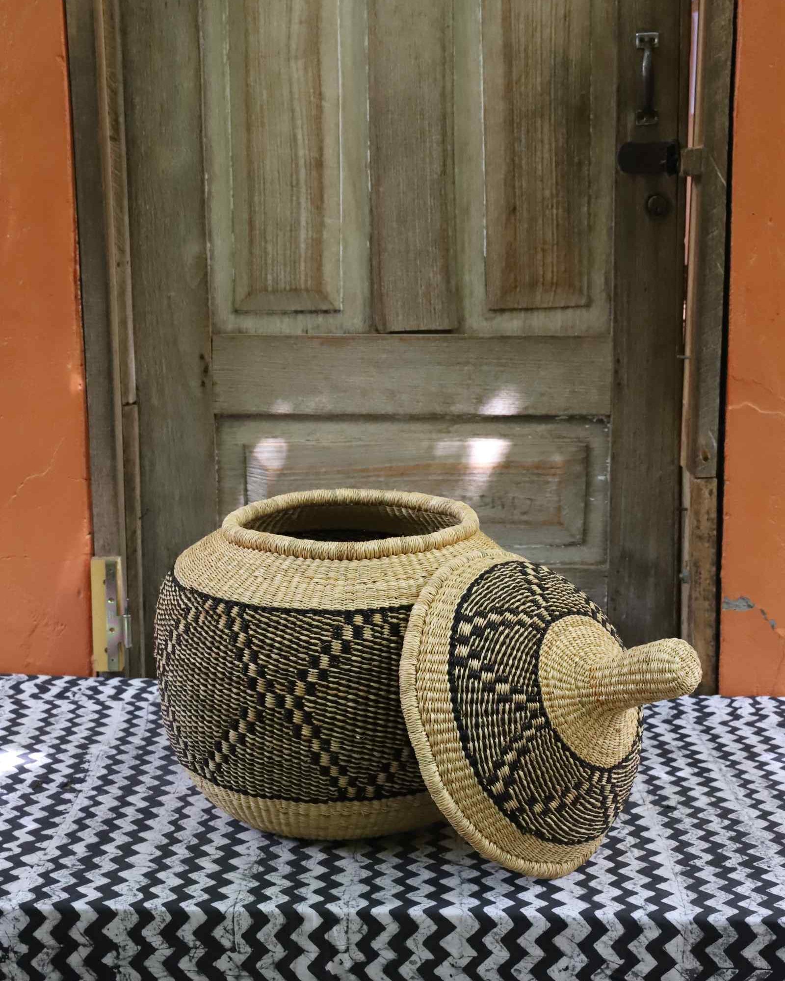 Handwoven round storage basket, medium, showing woven texture detail