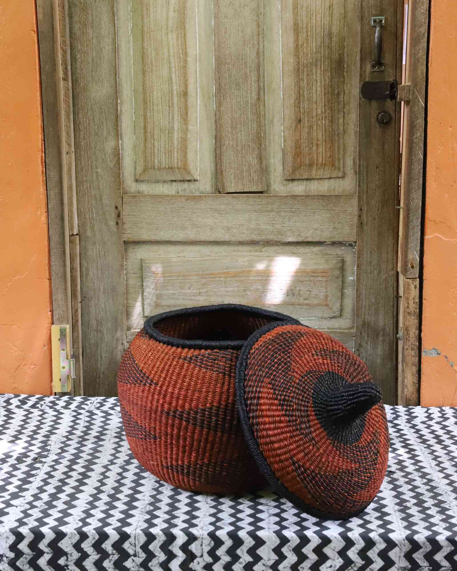 Medium globe-shaped handwoven basket showing woven pattern