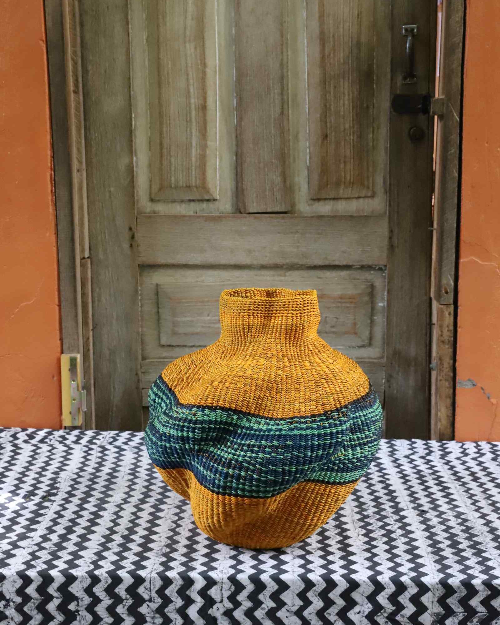 Handwoven Bolga art basket, small, with distinctive lobed sculptural shape