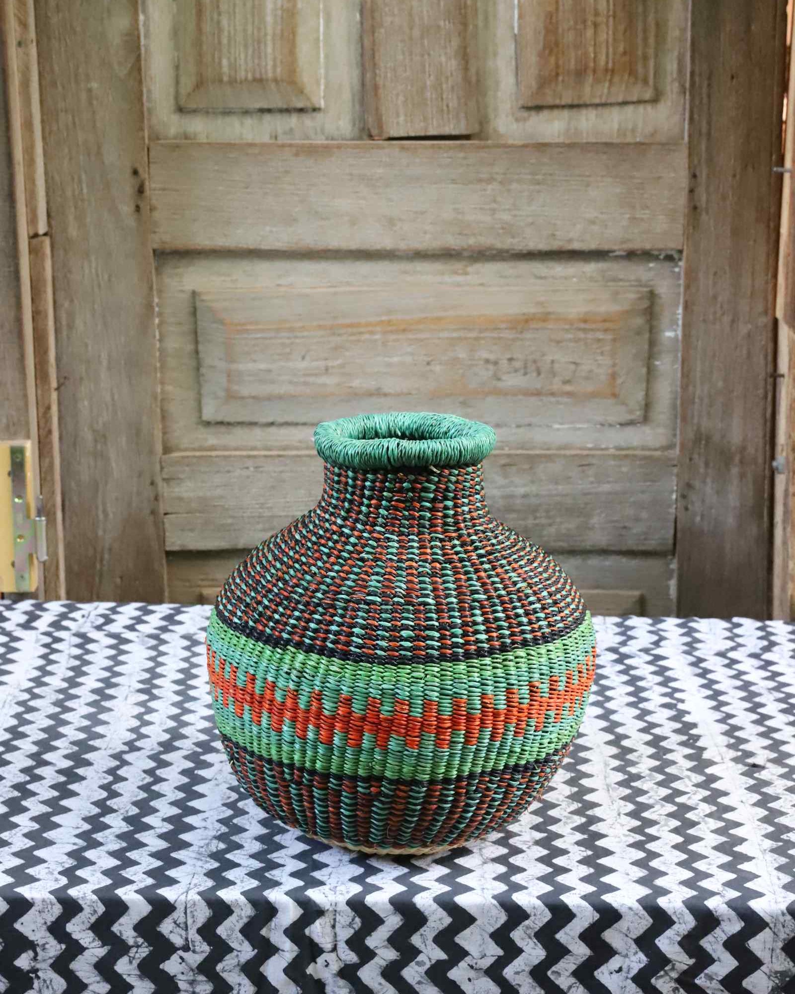 Tiny handwoven Bolga Décor basket with '10 Cows' woven design