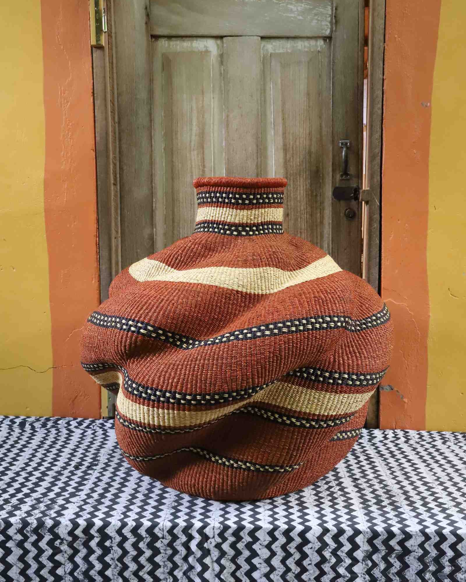 Large handwoven Bolga De-engo art basket in natural woven grasses