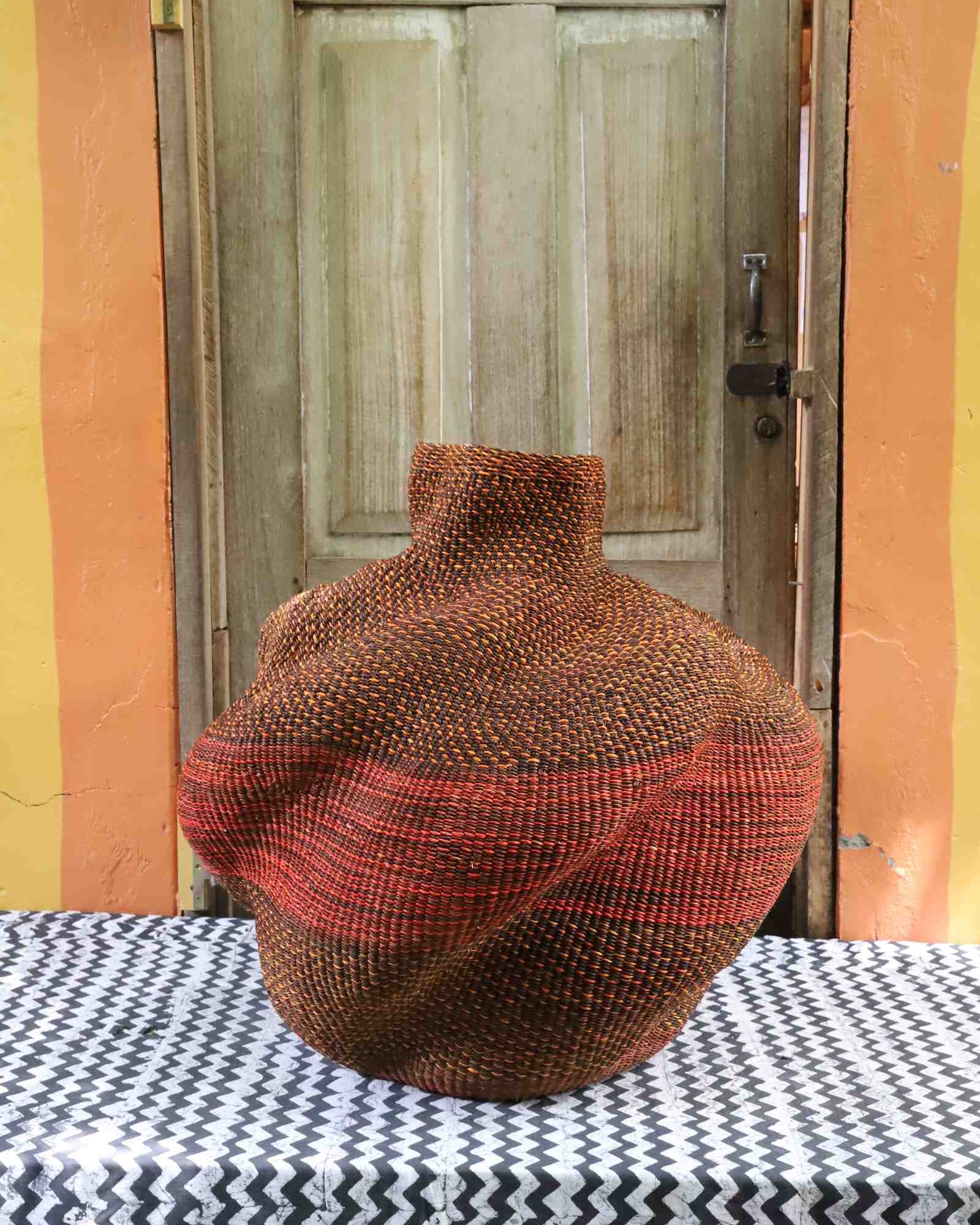 Handwoven Bolga art basket, medium, showing detailed lobed woven structure