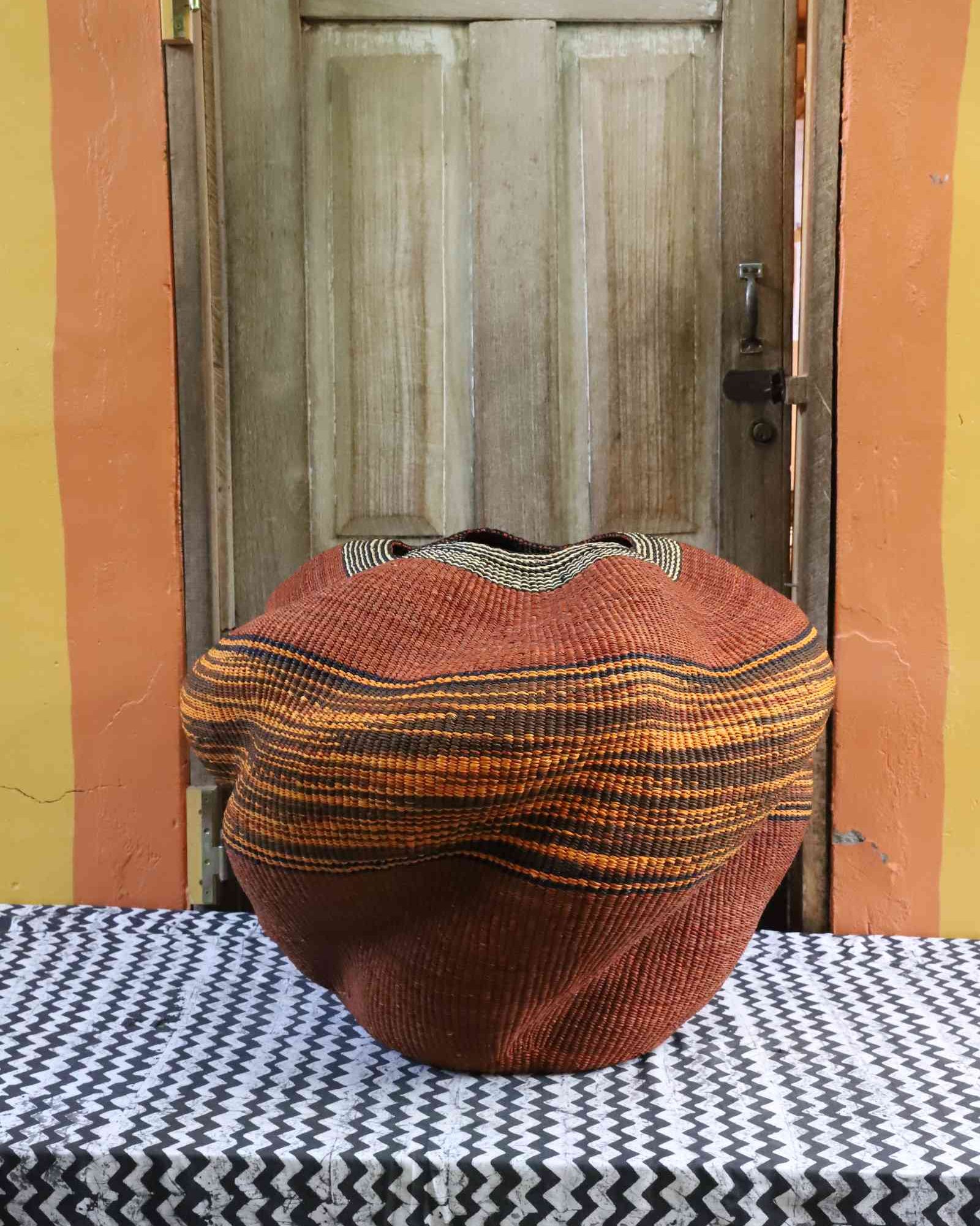 Handwoven Bolga art basket, alternate angle of sculptural woven form