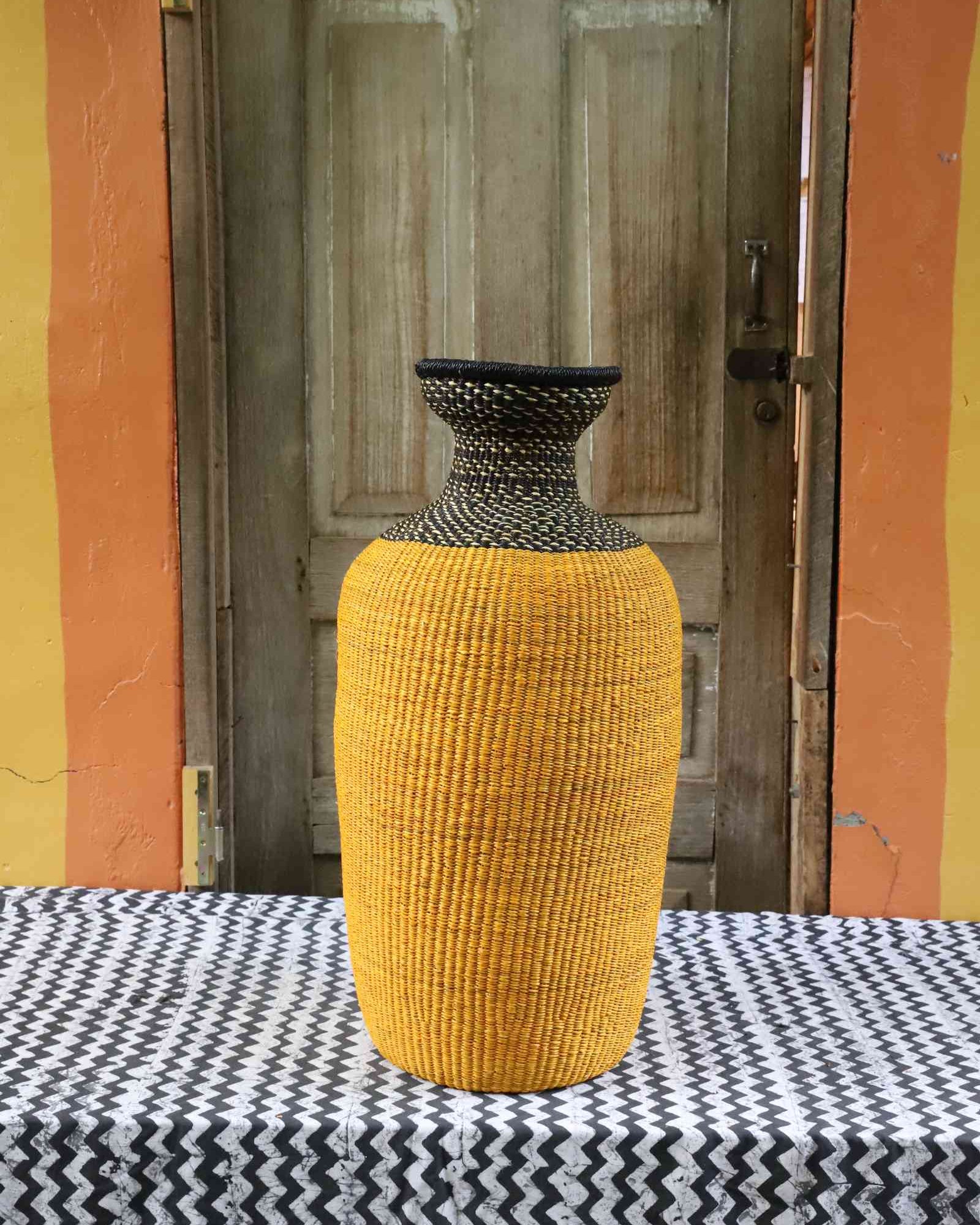 Medium handwoven Bolga art basket in natural woven grass