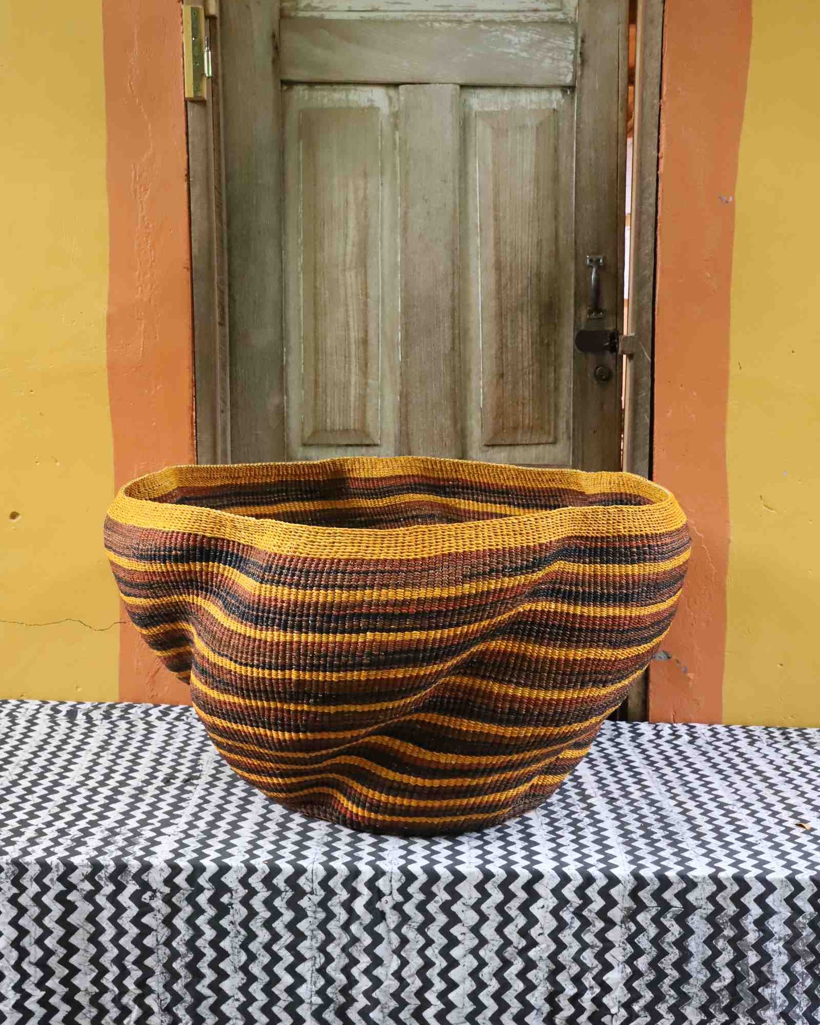 Handwoven Bolga art basket, wave form detail showing woven grass texture