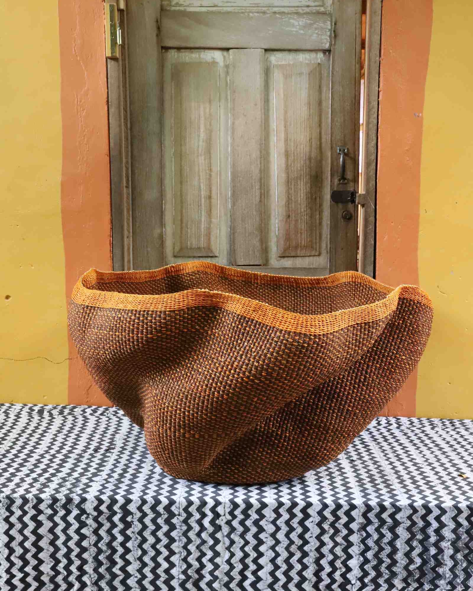 Giant Wave handwoven art basket, detail view of wave-shaped woven form