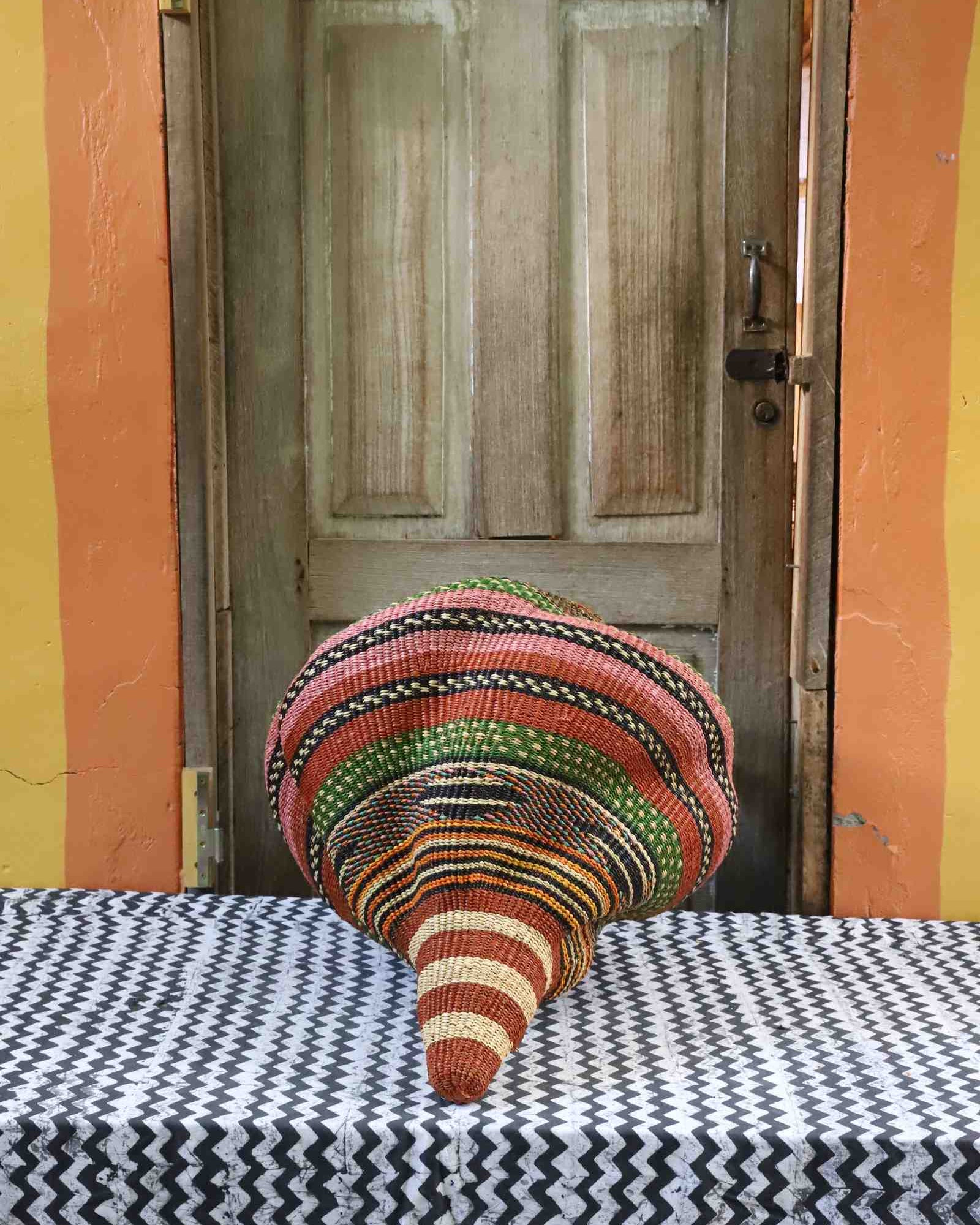 Medium conch-shaped handwoven Bolga art basket, top view