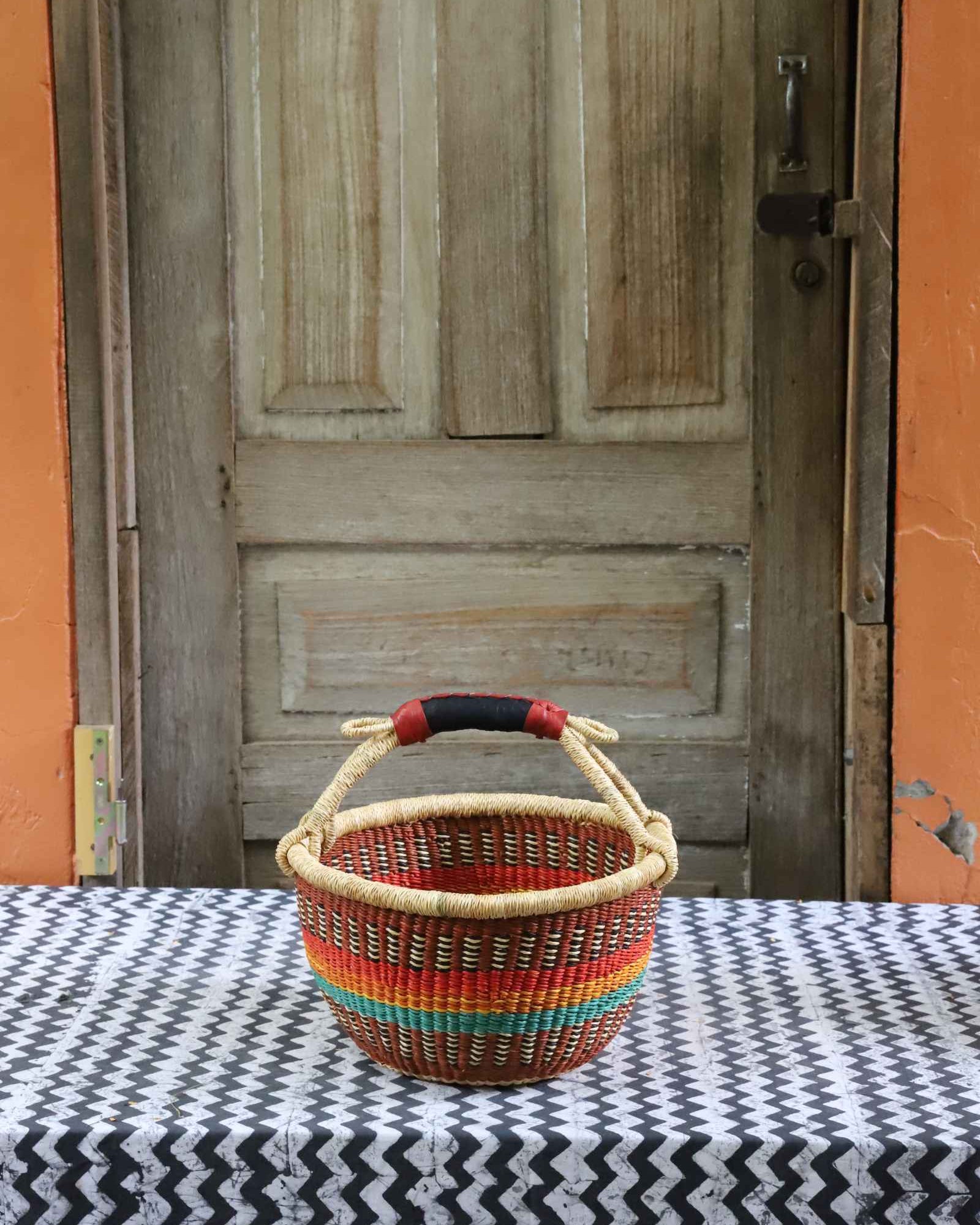 Small round shopping basket handwoven in elephant grass from Bolgatanga, Ghana.