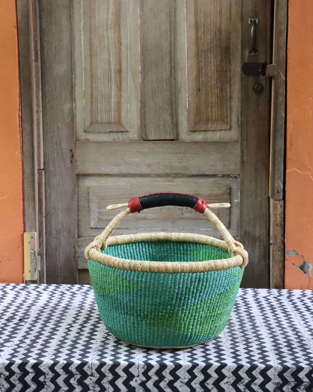 Round shopping basket, a handwoven Bolga basket in elephant grass from northern Ghana.