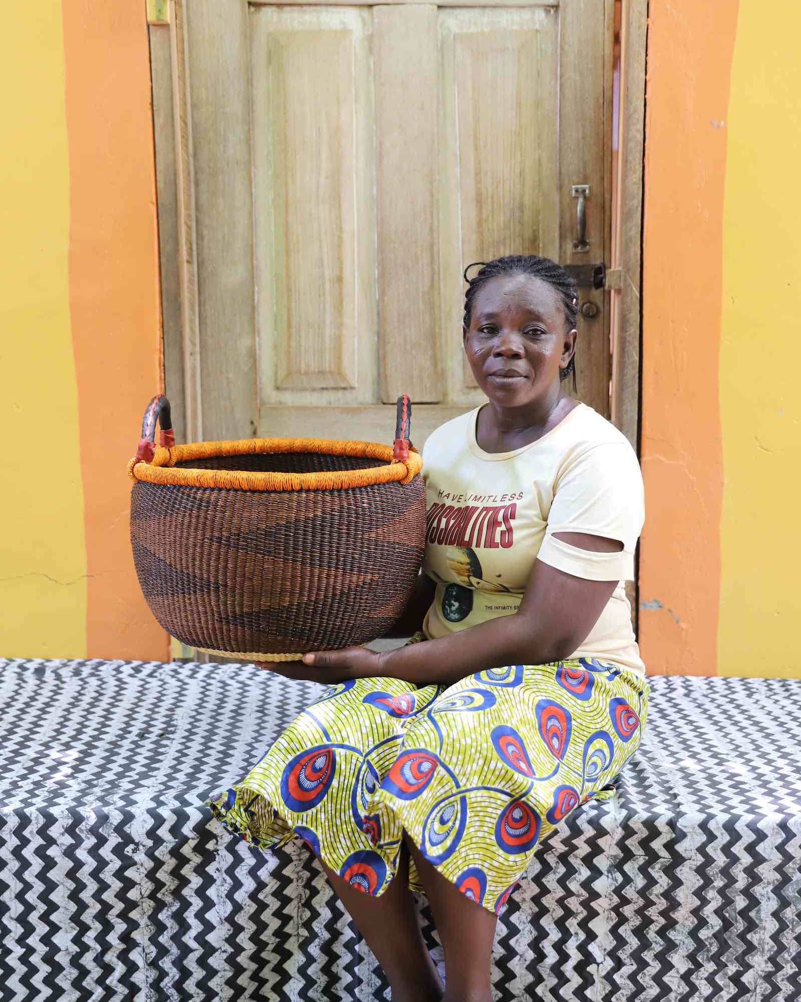 Gbenka medium handwoven African storage basket in a styled interior