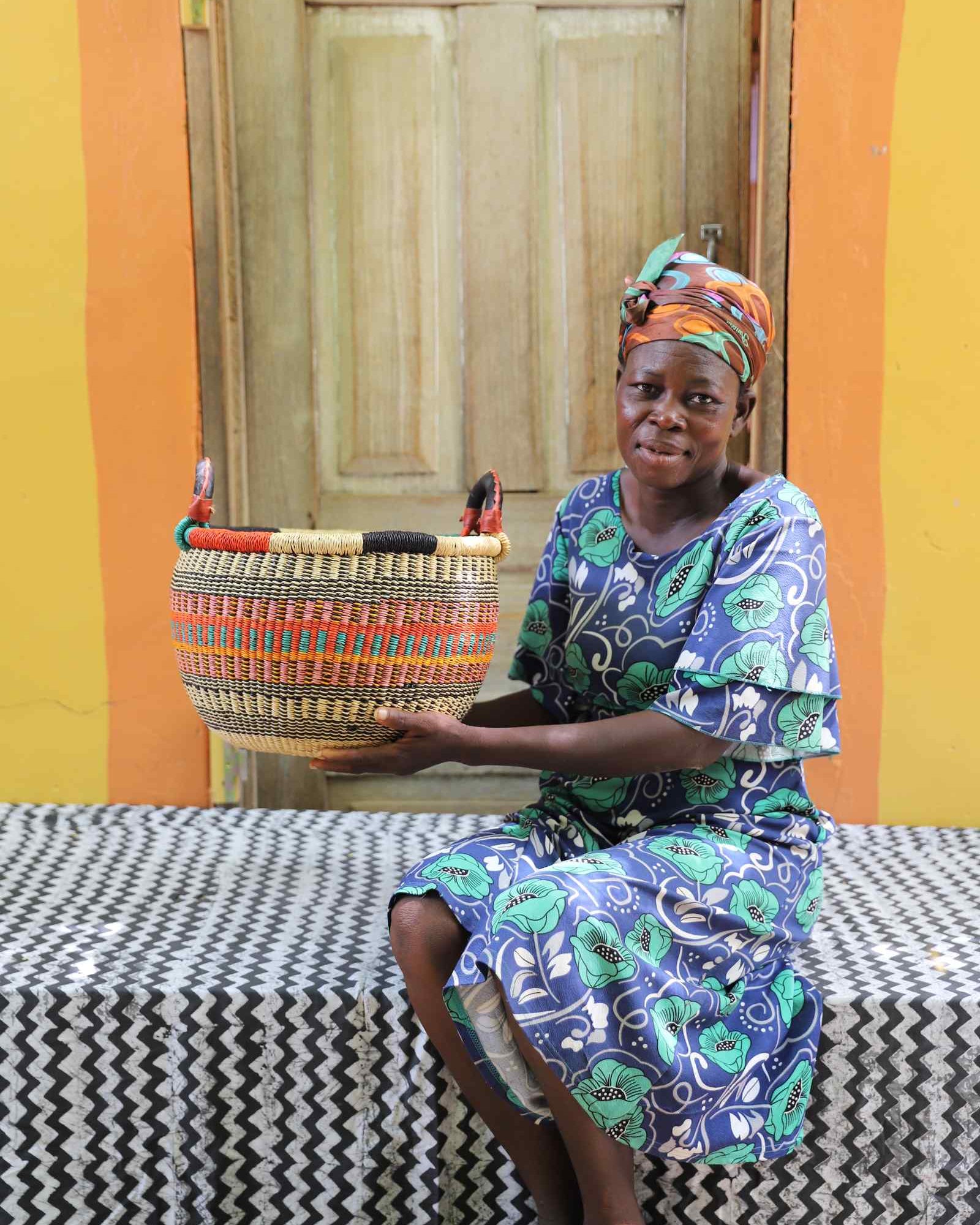 Small Gbenka handwoven African storage basket displayed in a home setting